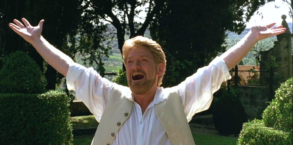 Image of Benedict raising his arms in joy from Much Ado About Nothing film. 