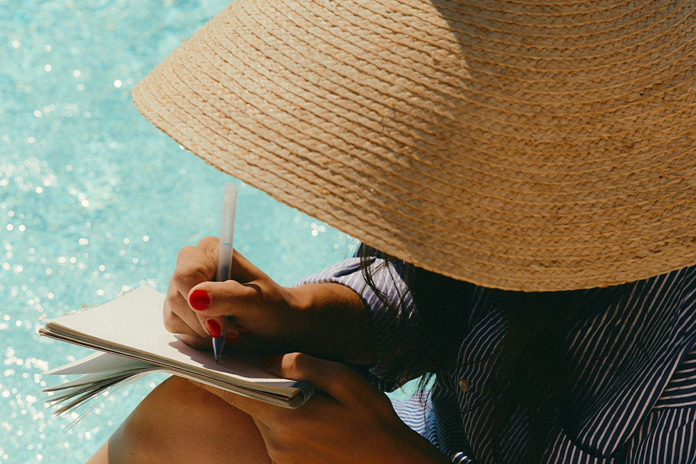 Writer in the outdoors taking time to write in serenity