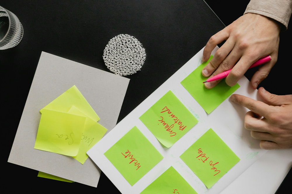 A woman structuring out a plan for a website in the way that one might structure out a story