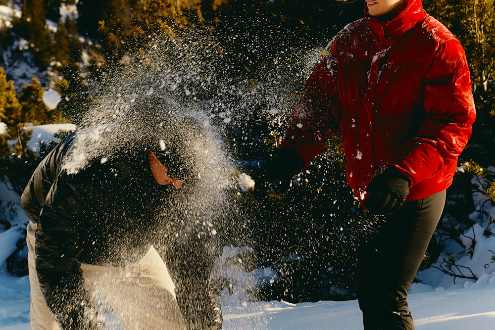 Feature image for types of conflict in literature––a couple having a snowball fight to illustrate how simple conflict can be.
