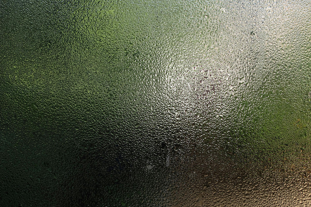 Window with a frosted glass filter on it that stops the viewer from seeing the beautiful outdoors