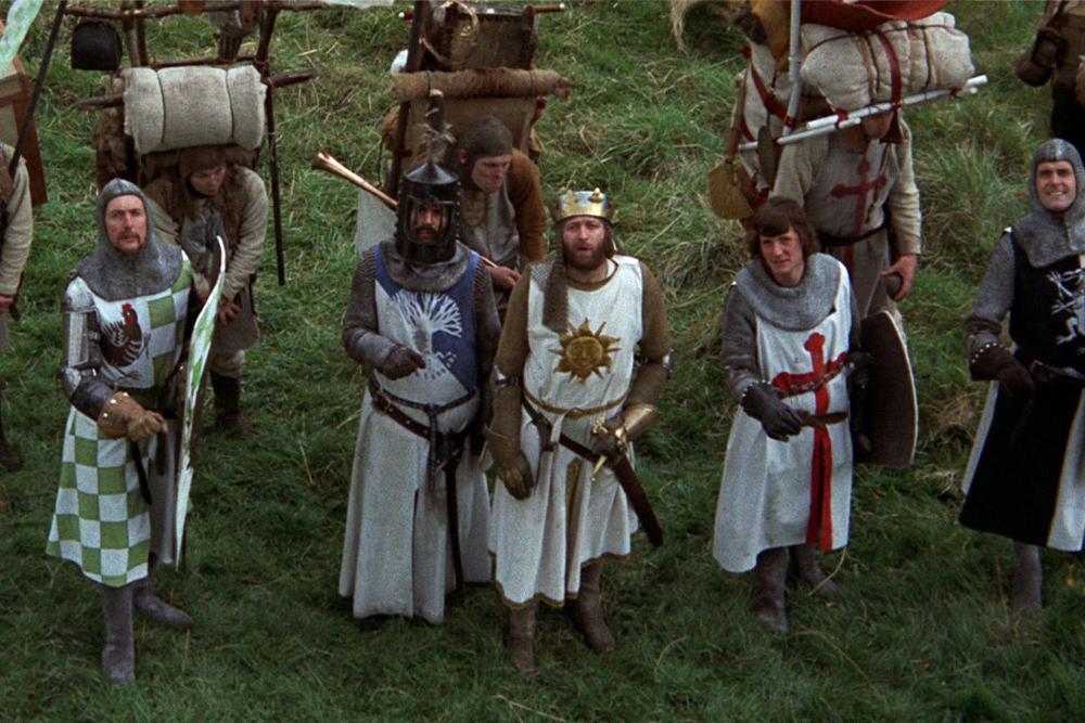 Image of Monty Python gang with poorly crafted tools to suggest the use of intertextual parody.