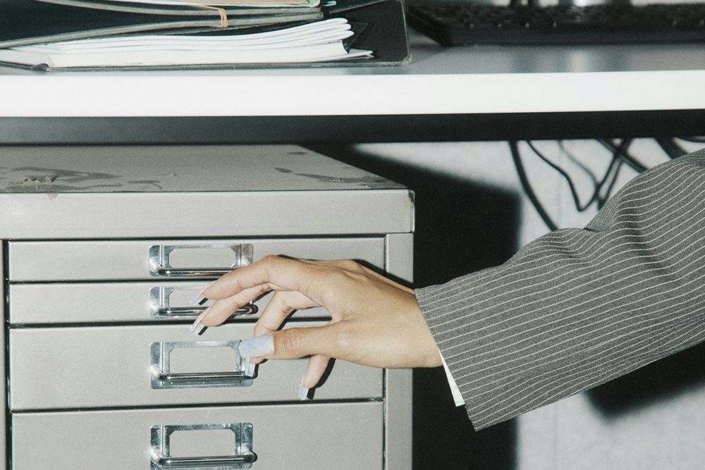 image of someone opening a cabinet to visualize the concept of privacy in using a pen name