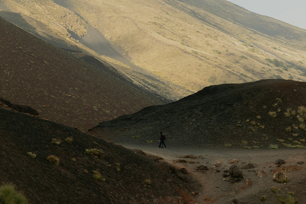 A trail between many hills and a lone runner, the solitude in the journey of writing mirrored by the solace that screenplay structure--presented as a trail--provides