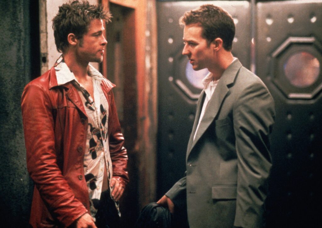 Tyler Durden visualized alongside the protagonist of the film Fight Club to represent the way a protagonist responds to the Man vs. Self conflict.