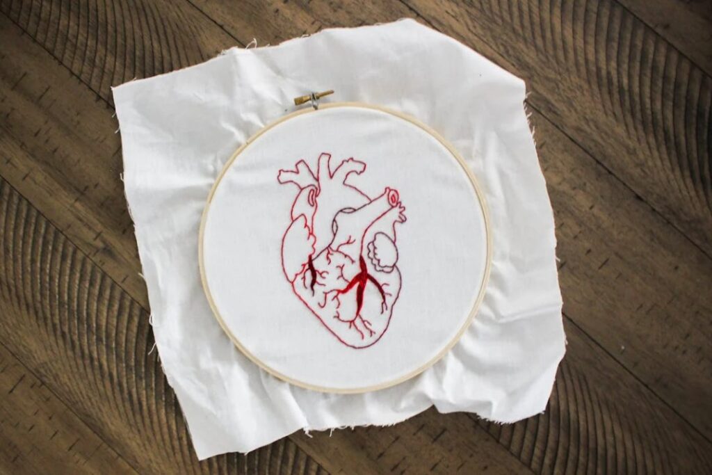 Image of an embroidered heart. 