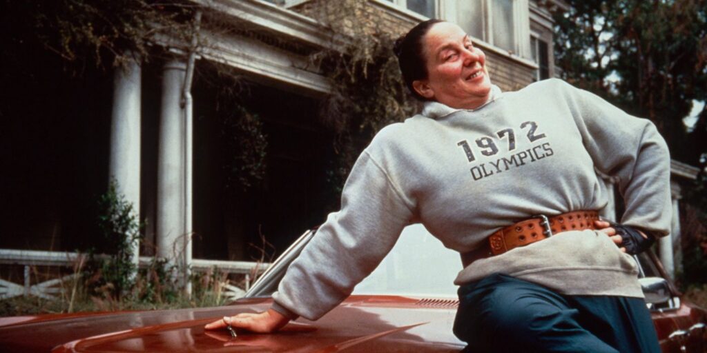 Miss Trunchbull smiling on a car to illustrate that even a flat character gives way to be imagined entertainingly