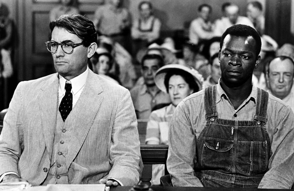 Atticus Finch defending Tom Robinson in a court of law.