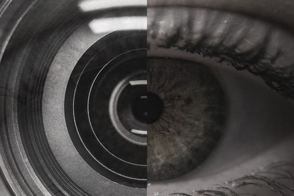Human eye and a camera lens in juxtaposition to create a visual metaphor that quickly relates to the writer that they must employ zooming out as a mechanical technique for the work to correctly result