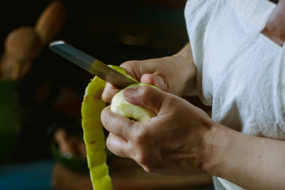 paring down your work is a lot like cutting fruit. you may like the peel but when it's for your readers sometimes they just need the fleshy bits to get at something that will serve their imagination