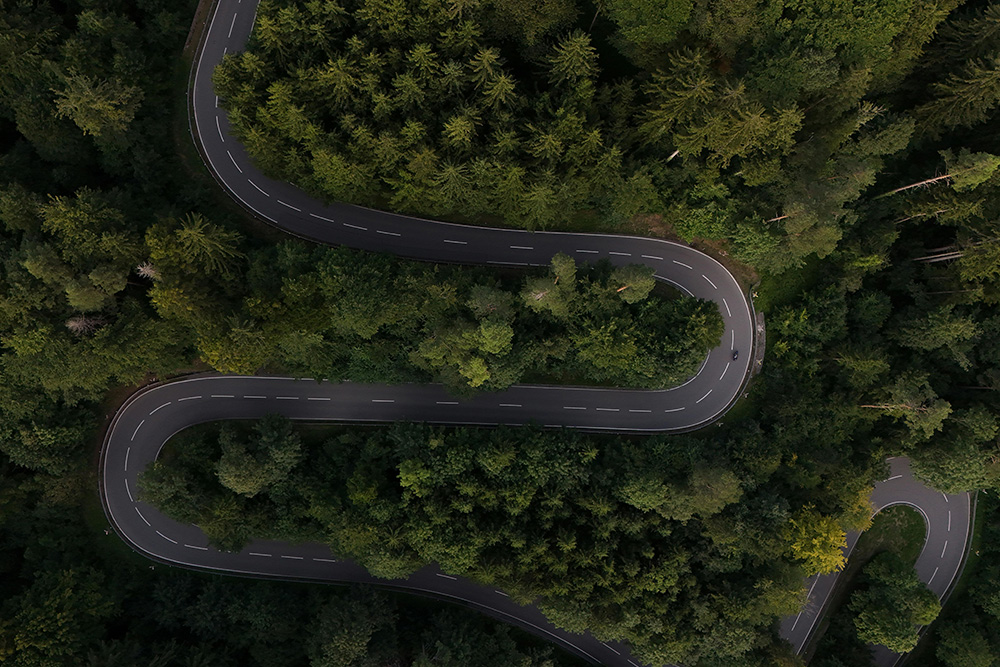 A winding road used as a visual metaphor to conceptualize how foreshadowing may be utilized by a writer in the plot of a novel, movie, or play