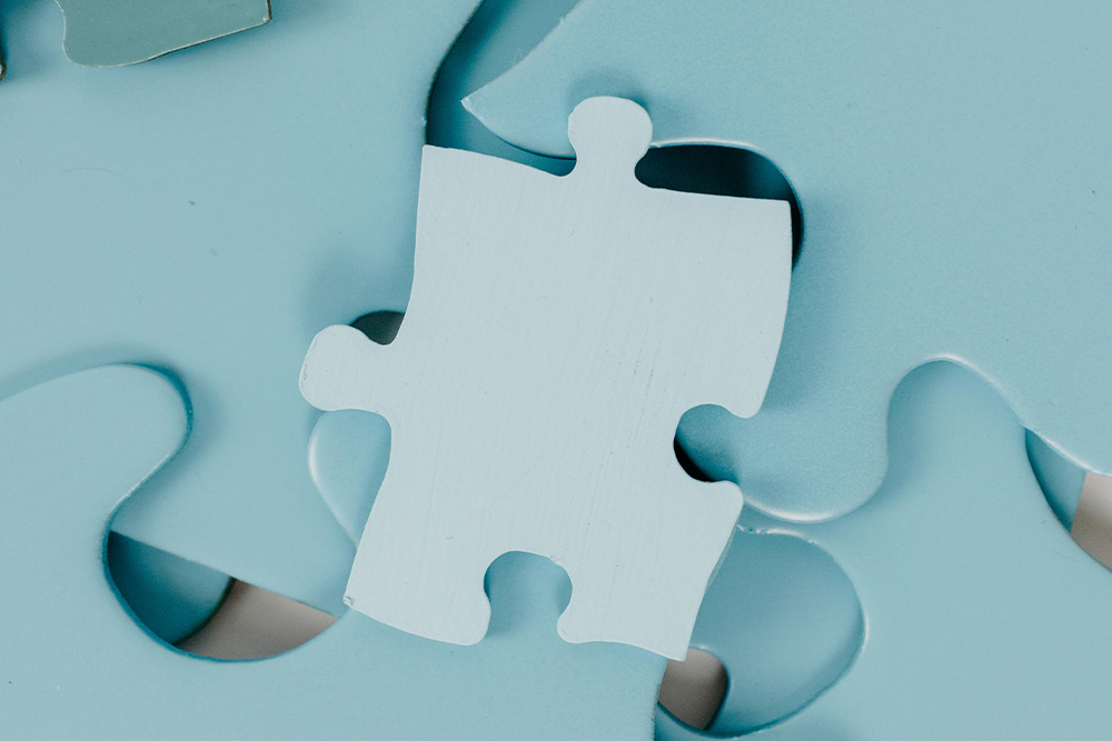 A puzzle piece of a slightly different shade and value to suggest a piece of a puzzle that doesn't fit, mirroring the visual metaphor for plot holes in the text below it