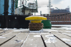A ship's mooring in a snowy part of the world to give a frosty visualization of Unmoored