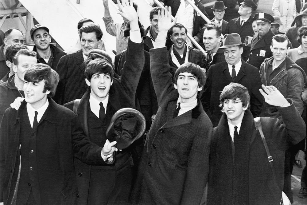 Image of the 10,000 hour rule used to visualize the Beatles at the height of their fame in a time following the realization of their successes.
