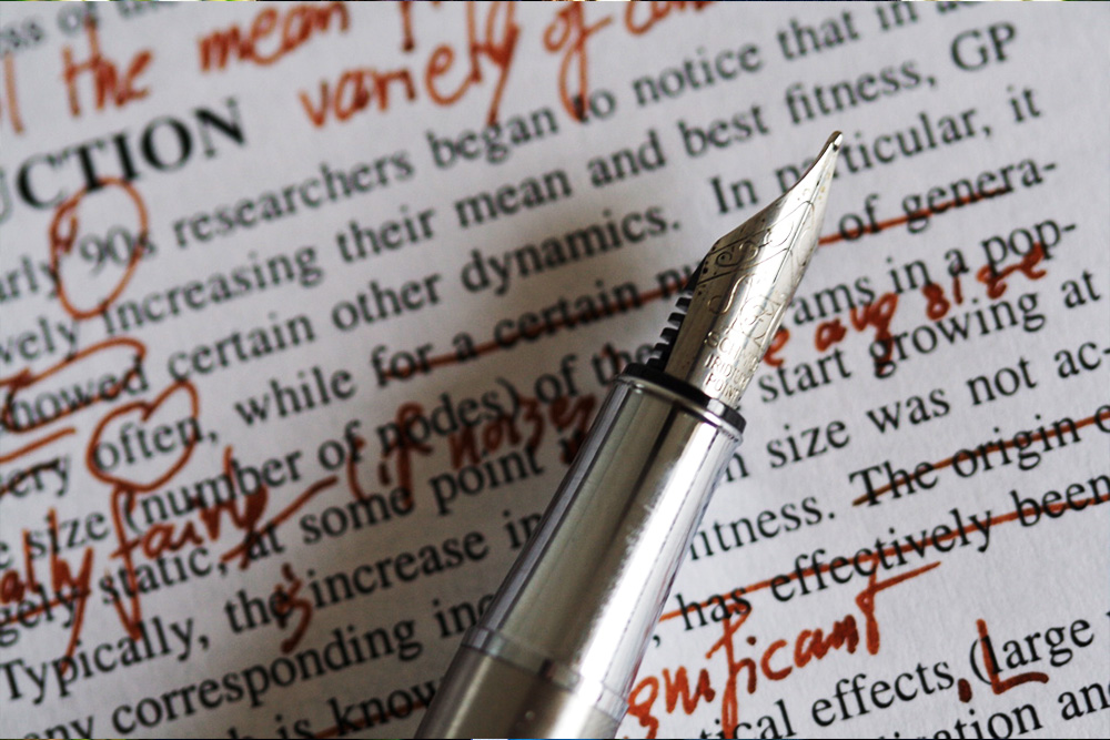 A picture of a pan next to a marked up page to visualize copy editing