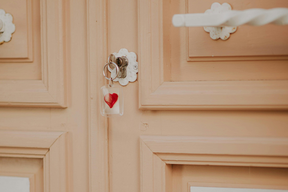A key with a heart shape on it explains how you often are in your own way when it comes to overcoming procrastination