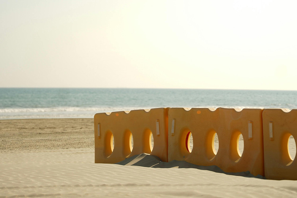 Beyond low barriers are the beautiful serene views of the beach, a way to understand overcoming procrastination