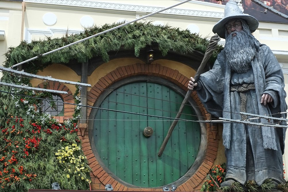 A picture of the hobbit's home with the mentor Gandalf visualized beside it as a representation of the meeting with the mentor in this kind of story structure