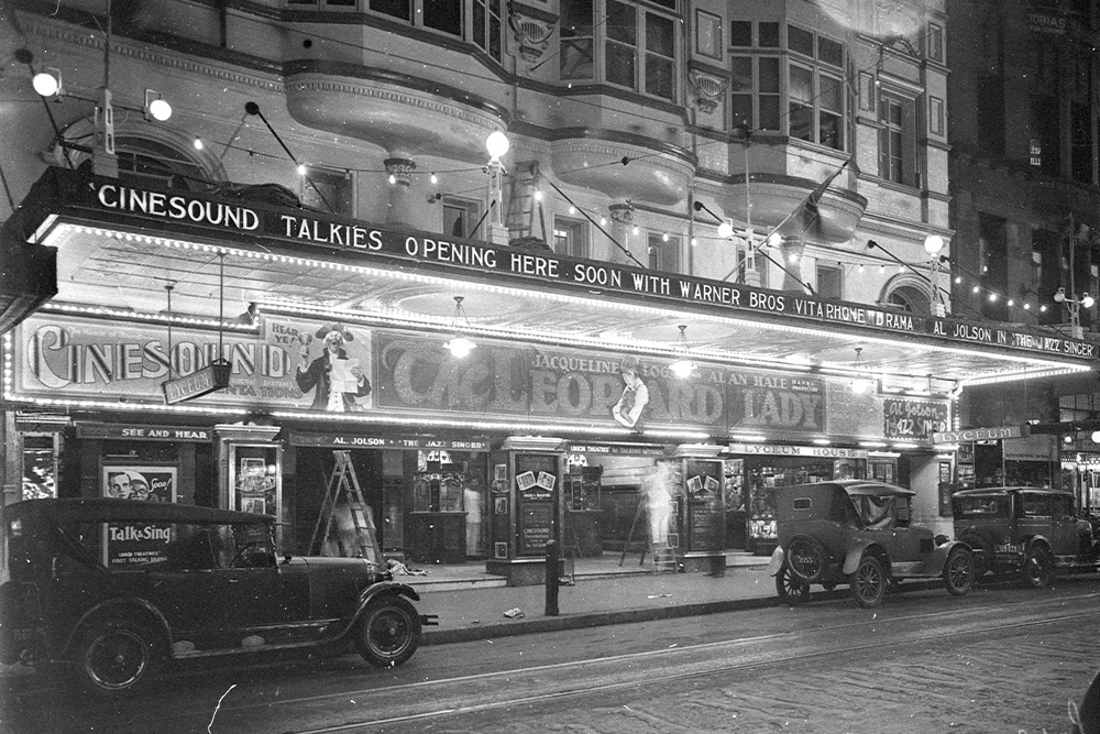 Track through the history of " what is a screenplay? " with the presentation of The Jazz Singer in theaters at the time it was released