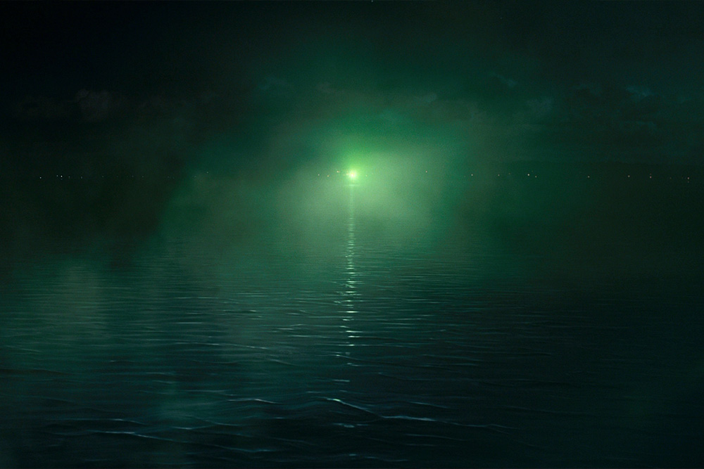 Green light from the text of the great gatsby quoted here visually to suggest how impossible the dream he has is to attain