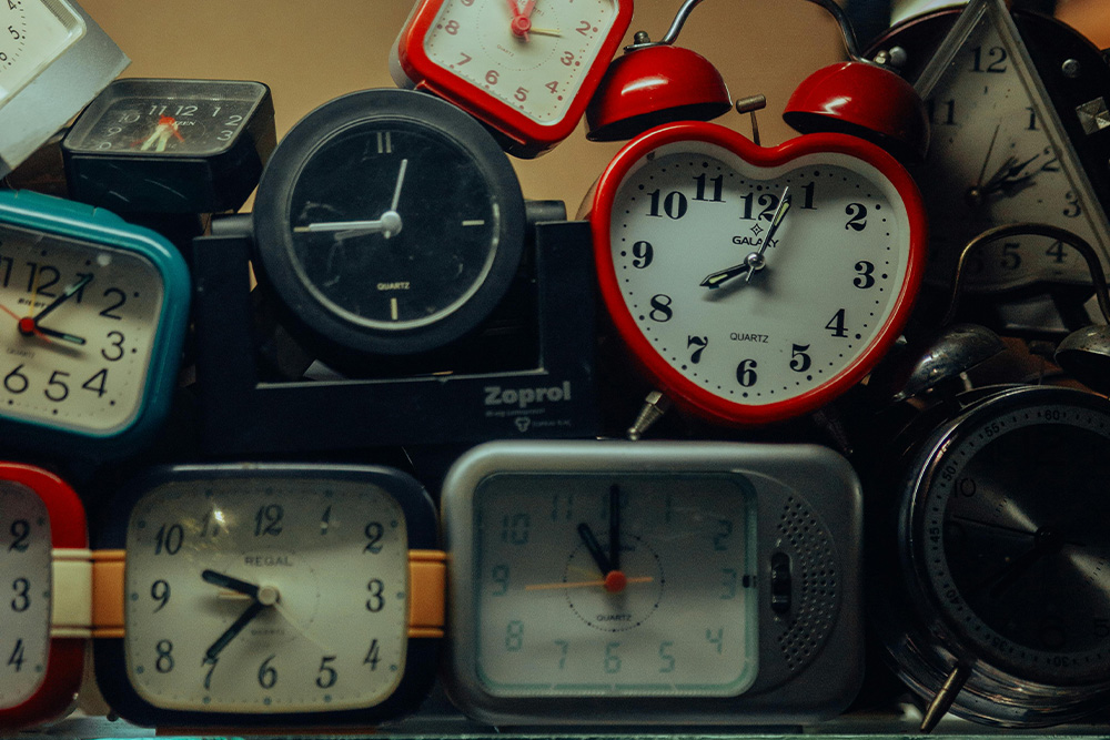 A series of clocks all showing different times suggest that every writer will have a different experience with when to use the Fichtean Curve