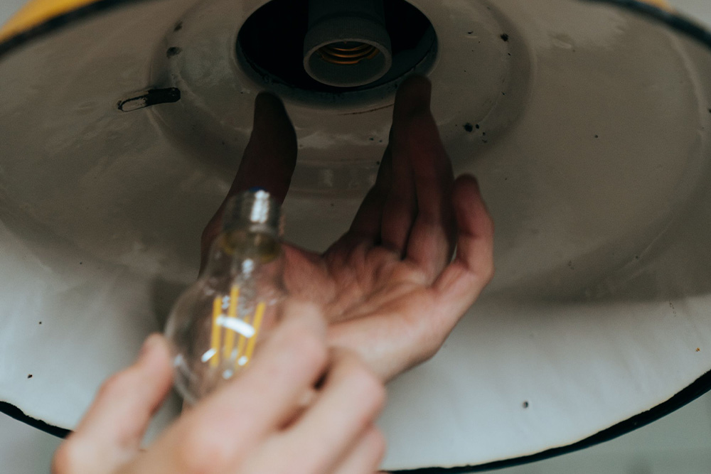 A lightbulb being screwed in. represents how the idea is never the whole story when you've lost the plot