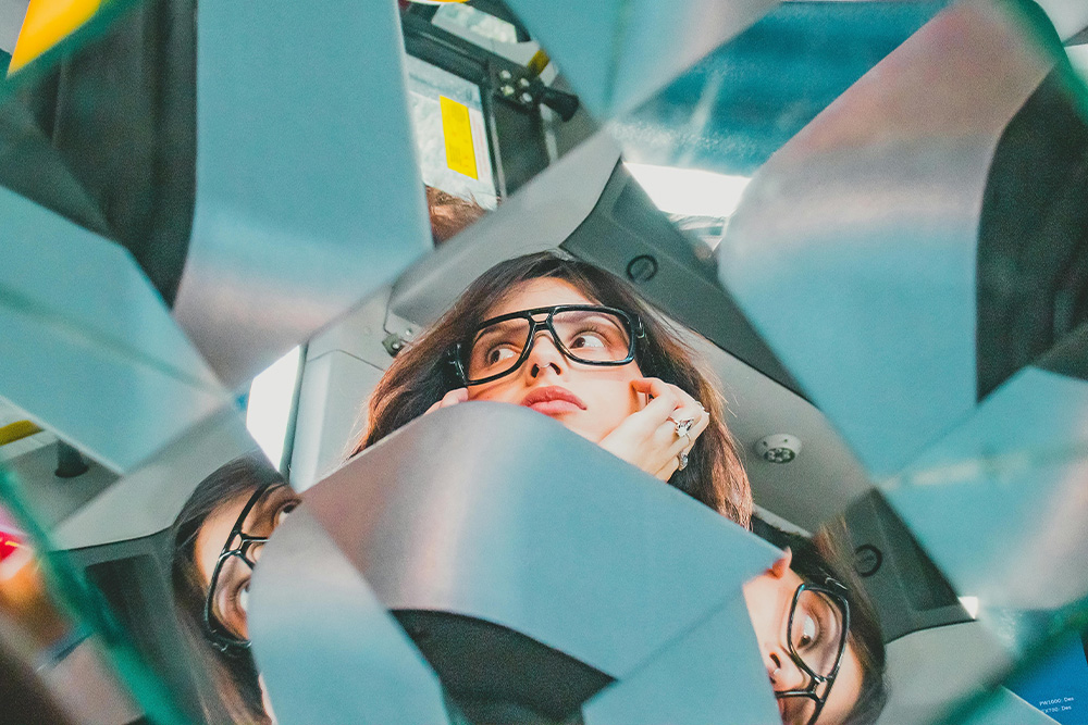 A woman thinks with a sort of wistfulness while kaleidoscoped to suggest the tension of knowing in an omniscient narrator