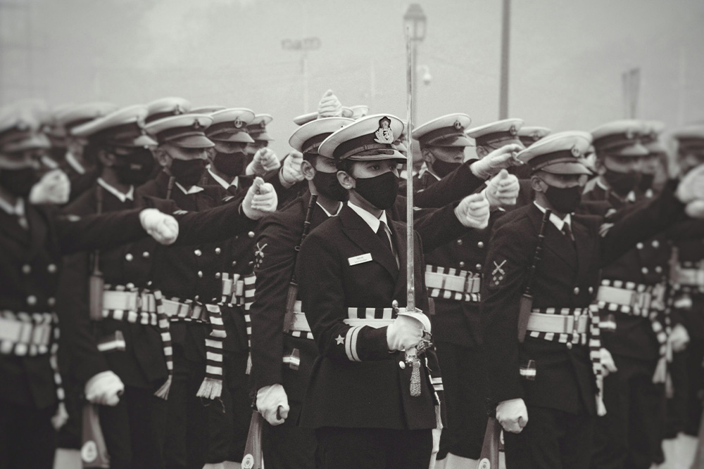 Soldiers stand at attention to suggest efficient order as parity to revising vs. editing