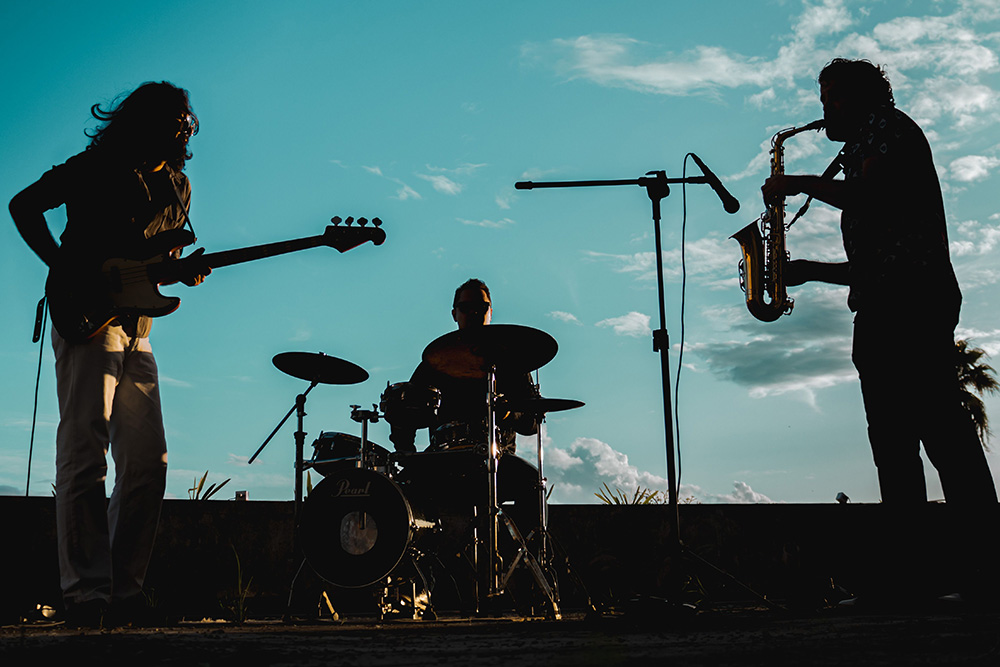A band all playing vastly different instruments to suggest what is rhythm for different kinds of writers