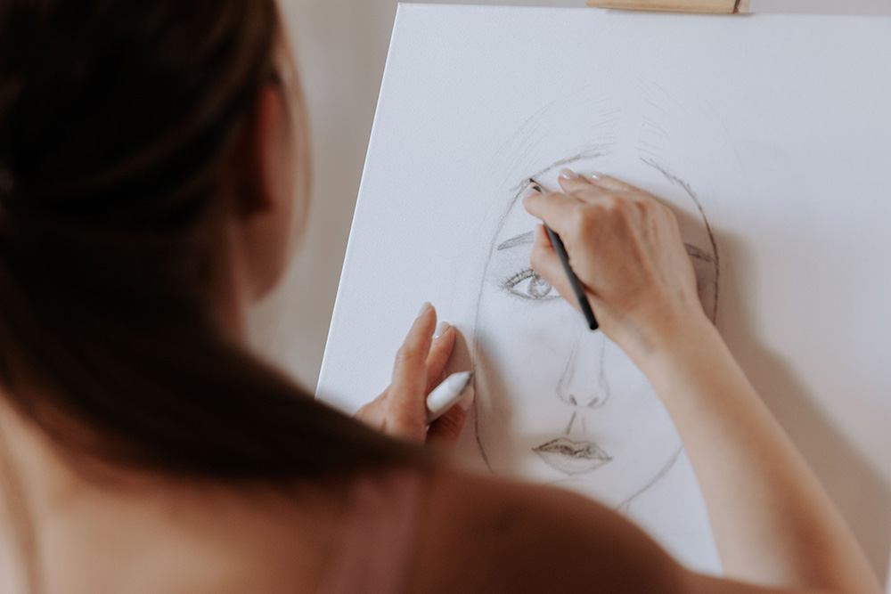 A self-portrait being painted suggests a visual parity to how one draws their core values to a character sheet