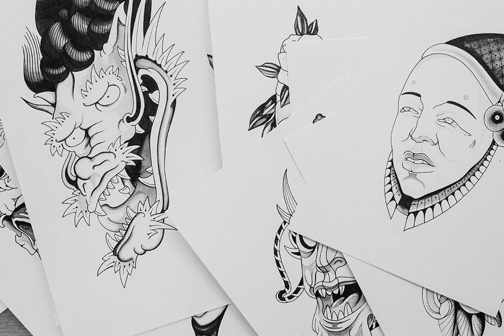 Characters drawn on papers suggest that character sheets are physical illustrations that offer details that just characterize something