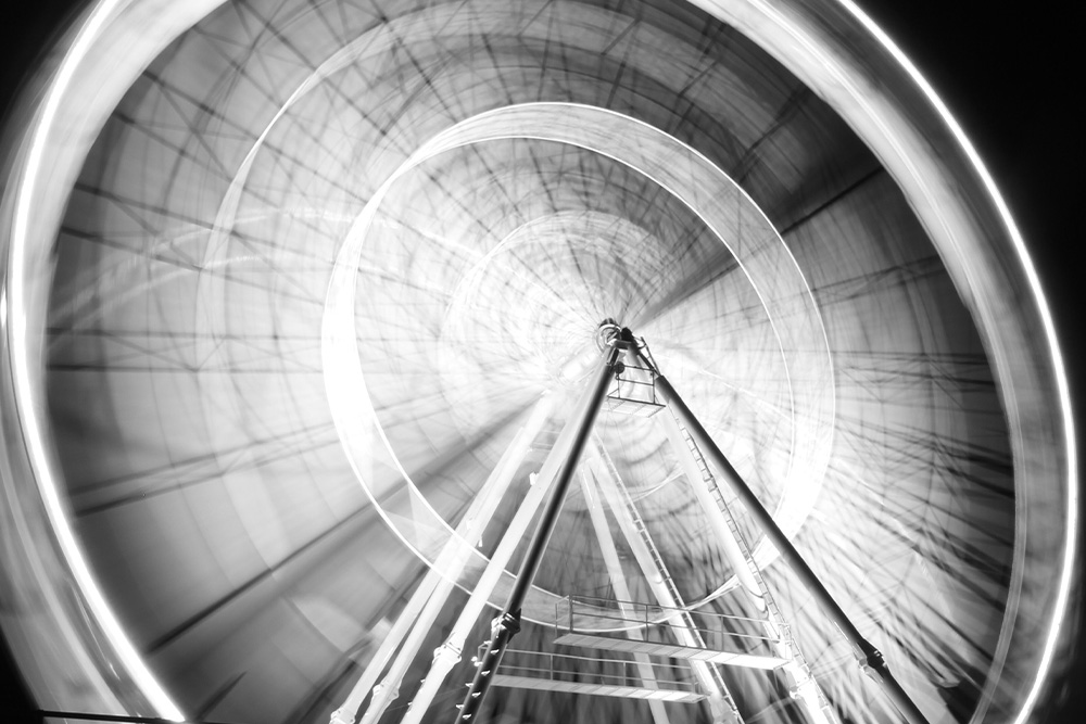 Ferris wheel in low shutter motion suggests that a cumulative sentence helps draw out a feeling or a moment in slow time practically and describes visually a passage of time