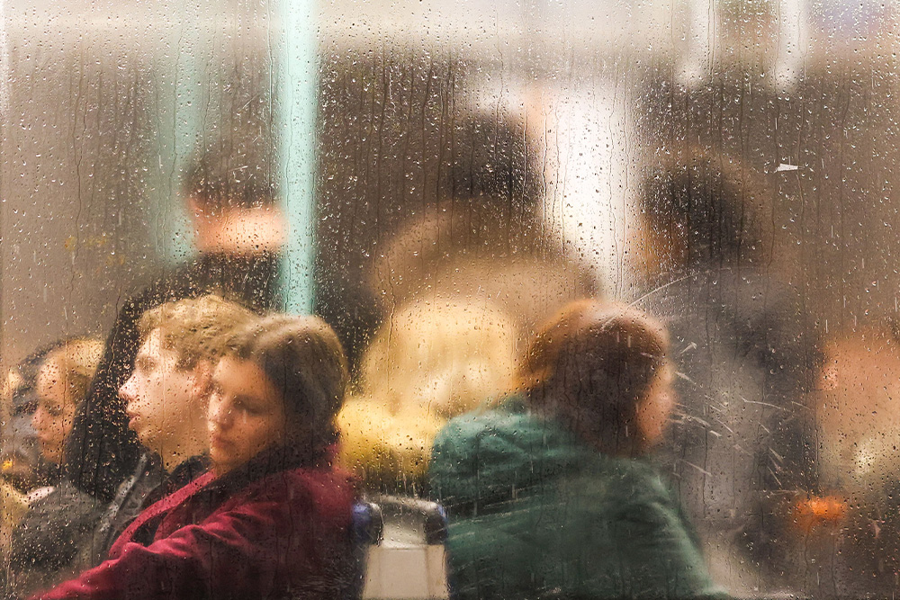 People wear a range of emotions before a frosted rainy glass window to suggest the invisible "said" 