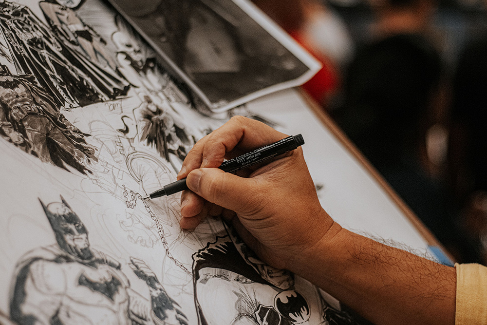 Hand painting heroic characters to suggest how to write the hero archetype as a compelling character