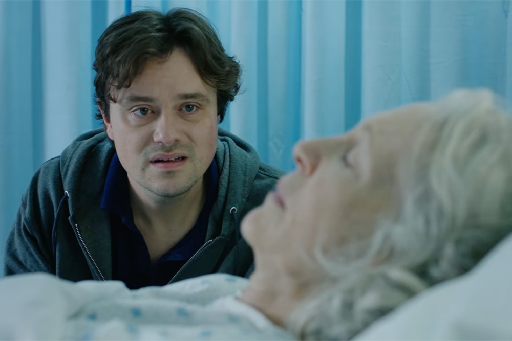 Still from Jennette McCurdy short film includes character from self-write that is later purposed for the novel against the mother's hospital bed as an example of giving a sense of relationship in how to start a memoir