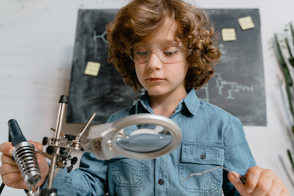 A child looking under a microscope suggests that with a real process, line editing becomes a very simple way to work with the material