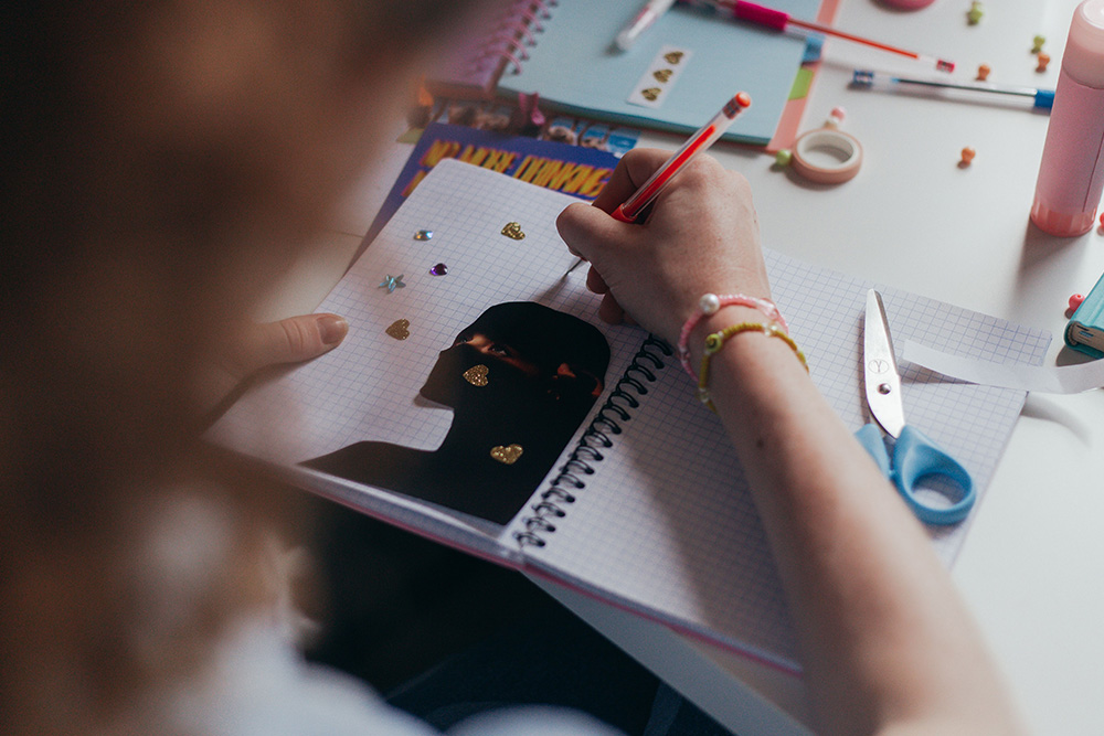 A creatively scrapbooked journal suggests that writing journals should be fun