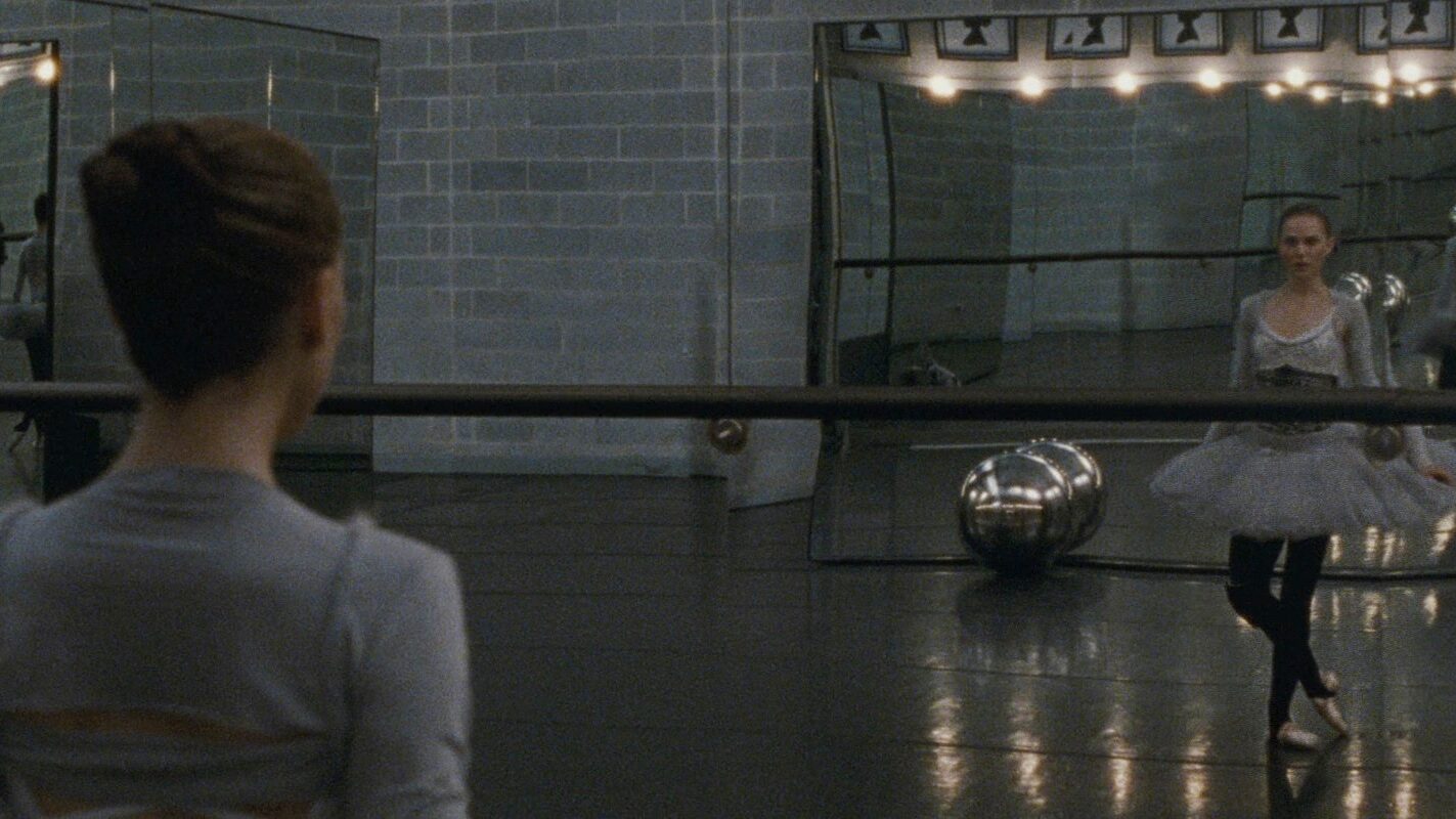 A ballerina observing herself from Black Swan to suggest antagonist examples in this movie