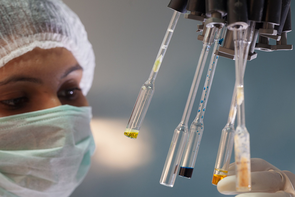 A lab setting with a woman doing tests in a centrifuge suggests that there are tests to figure out book title ideas 