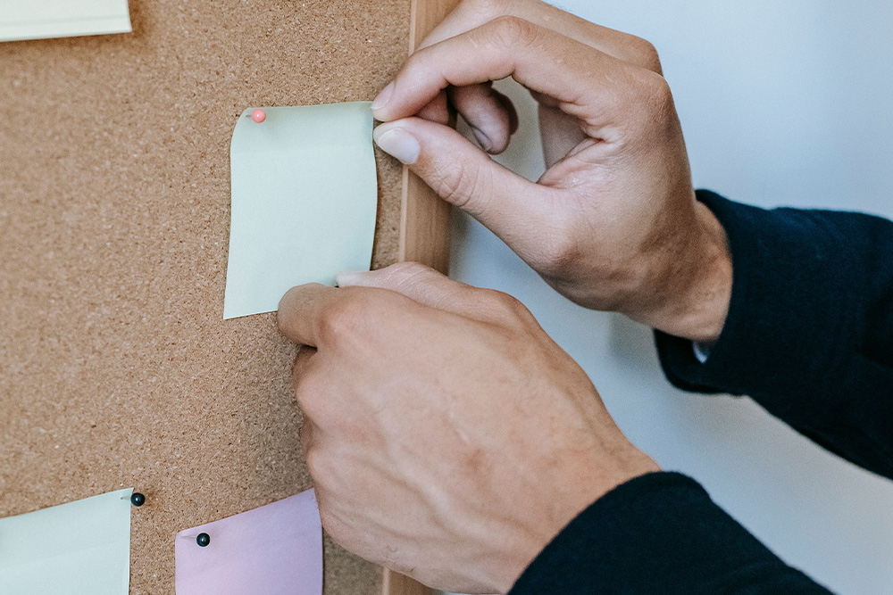 A blank note on cork board suggests that different writers need different things based on forms for book title ideas