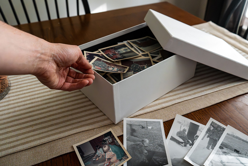 Photo albums with photos pulled out to suggest example in how to end a memoir