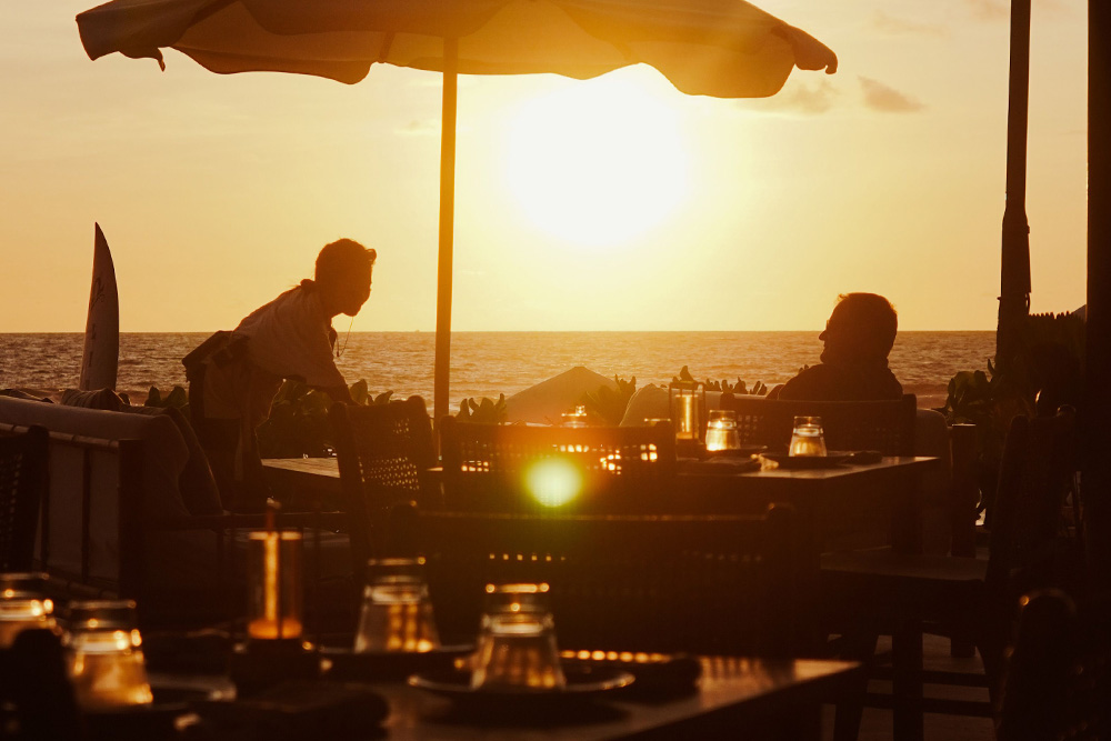 Two men at a beach suggest the places of mood vs. tone in how a setting is achieved, that the two are in conversation with each other
