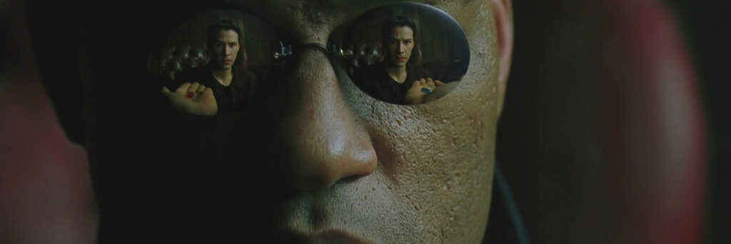 Neo reflected in Morpheus's eyes from the film The Matrix to demonstrate literally how these types of characters force the protagonist to confront change