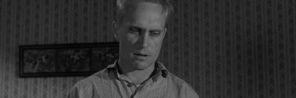 Boo Radley in his appearance in the film to suggest how he appears symbolically in the film
