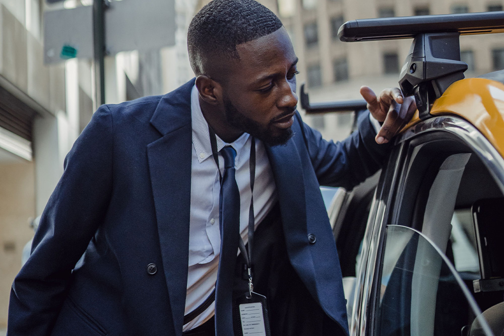 A man looking into a cab to suggest there are certain lengths you may go as a standard when deciding what is an imprint