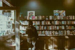 A person staring at a big volume of books suggests that it is important to know what is an imprint