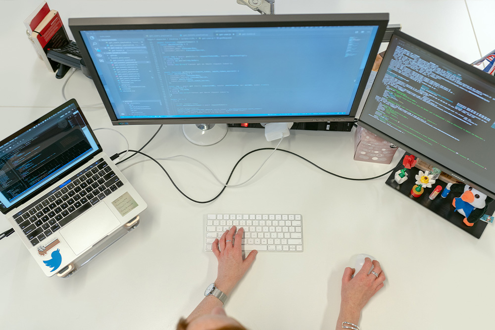 Someone typing into a coding IDE to suggest that writing your own writing rules is like developing in computer science
