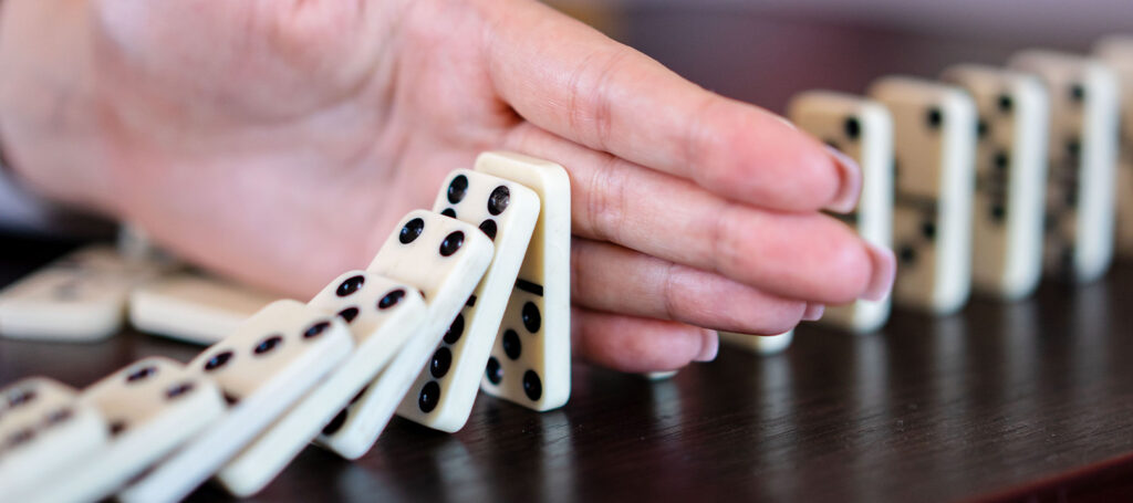Picture of dominoes used to visualize plot as a series of events in elements of fiction