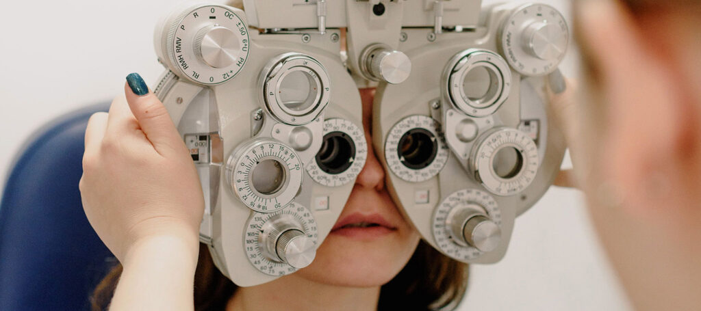 An eyeglass provider helping someone with a prescription to determine for writers how points of view may be ascertained in elements of fiction