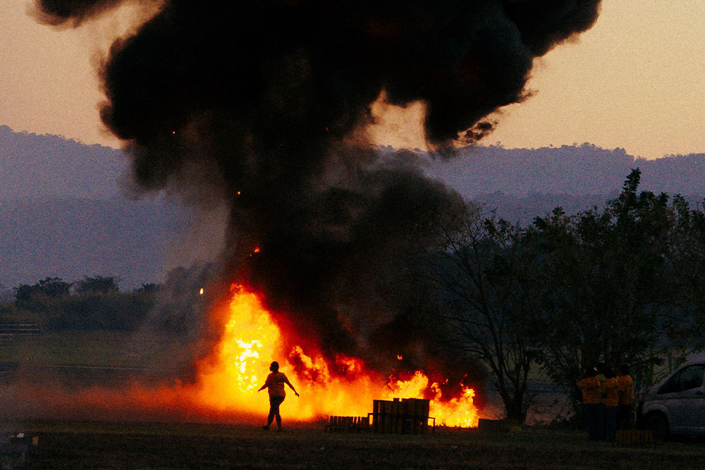 A person burning down a camping site suggests that anyone can make a mistake with elements of fiction